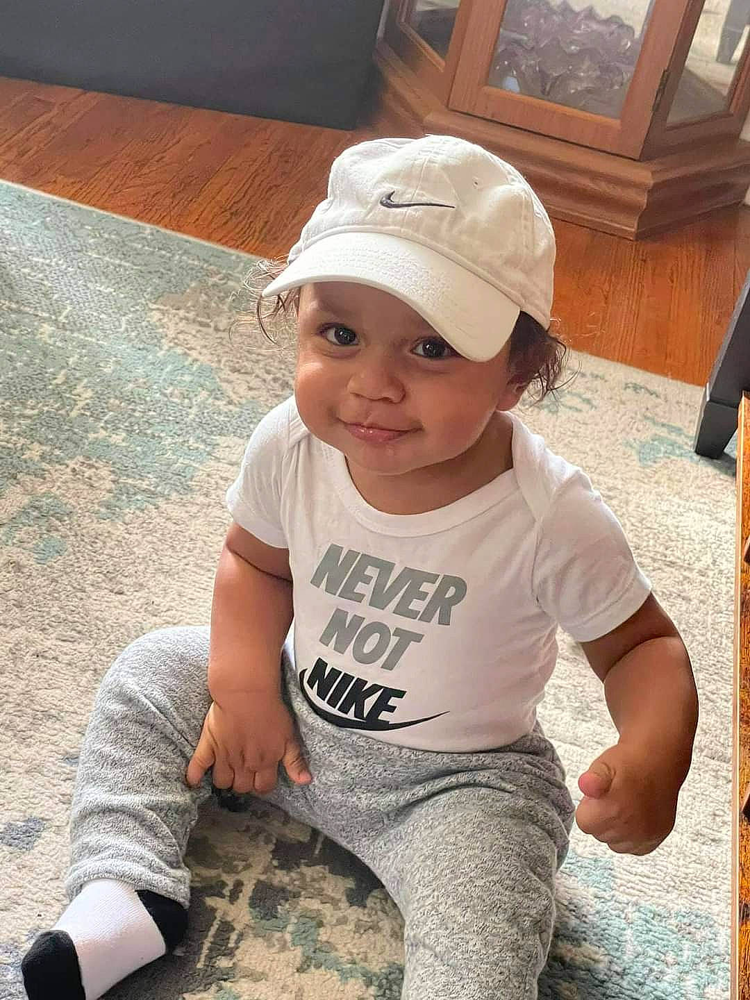 Cash is registered to the contest to win money with this photo: baby_toddler_clothing, baseball_cap, cap, child, cool, eyewear, flooring, fun, hairstyle, happy, hat, headwear, human_leg, joy, person, sleeve, smile, summer, t_shirt, thigh