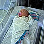 Abby joined the competition — help win amazing prizes! newborn, baby, swaddled, pacifier, hospital, bassinet, blanket, sleeping, infant, bed, sheet, person, newborn_bassinet, medical, healthcare, quiet, resting, indoors, soft_light, patient