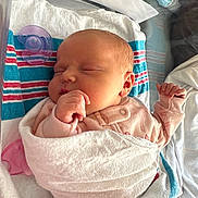 Abby joined the competition — help win amazing prizes! newborn, baby, sleeping, blanket, hospital, pacifier, infant, swaddled, peaceful, soft_lighting, pink_clothing, closeup, portrait, cute, small_hands, resting, indoor, healthcare, newborn_bed, baby_face