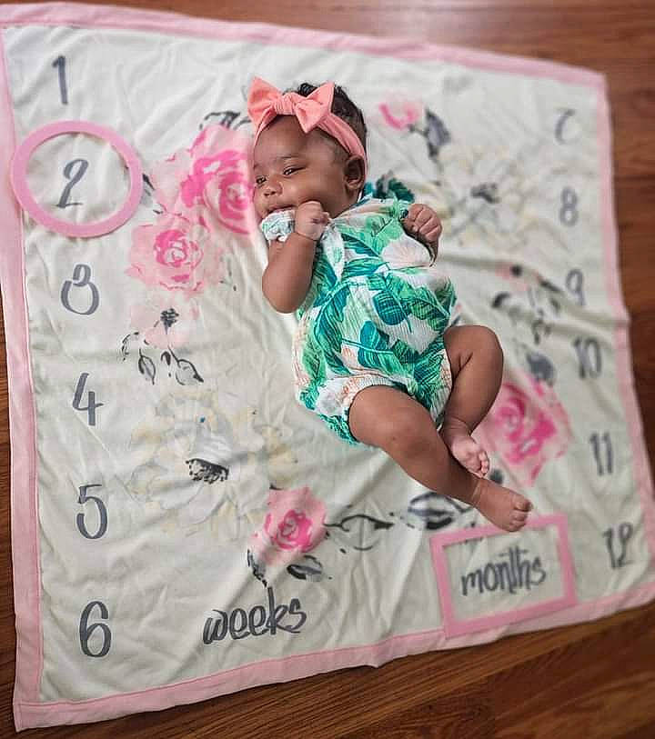 Rori Lynne joined the competition — help win amazing prizes! baby, baby_toddler_clothing, bedding, child, comfort, face, font, happy, linens, magenta, pattern, person, pink, rectangle, sleeve, smile, t_shirt, textile, thigh, toddler