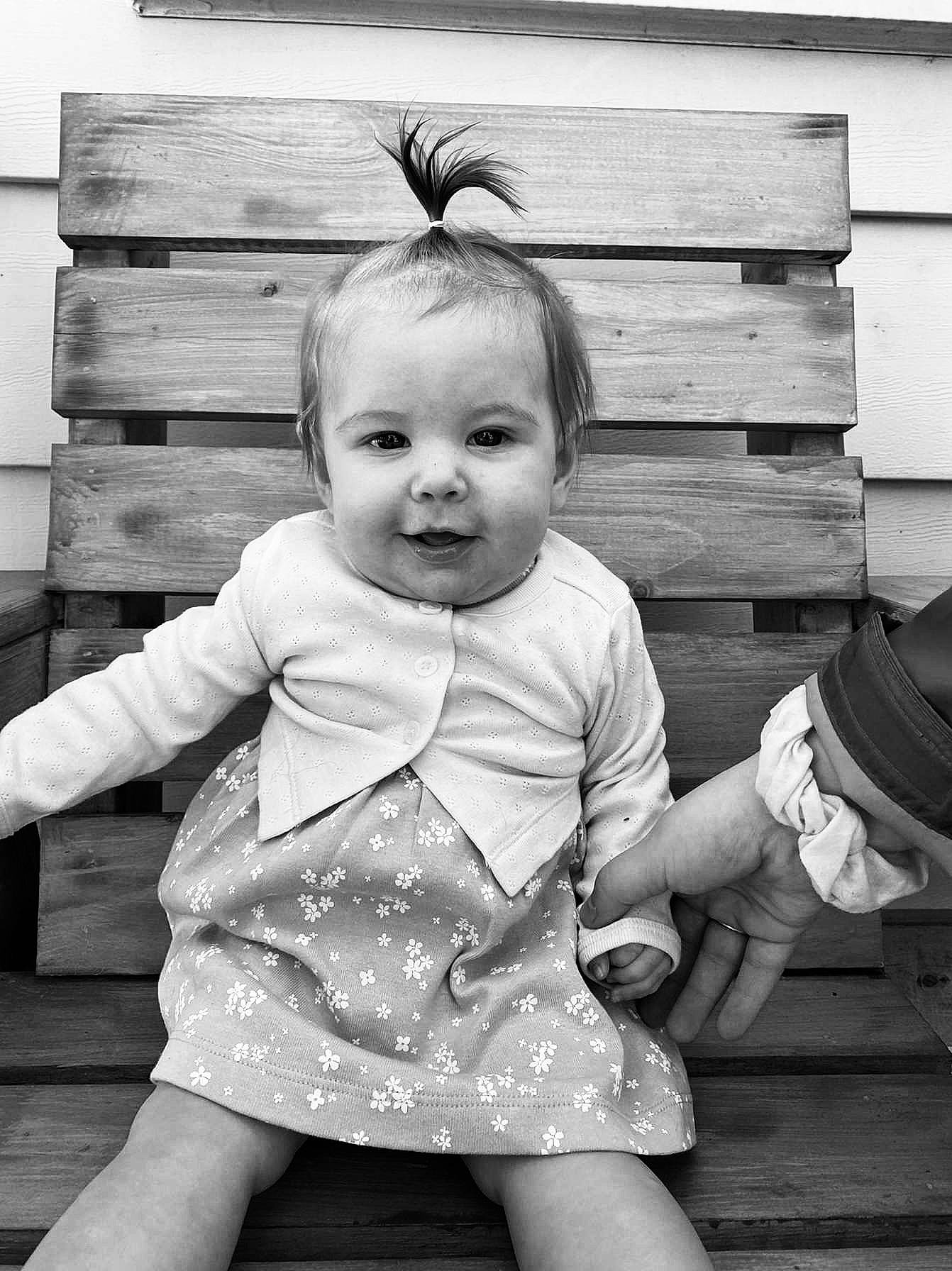 Ella joined the competition — help win amazing prizes! baby_toddler_clothing, black, black_and_white, cheek, dress, eye, facial_expression, flash_photography, gesture, hairstyle, happy, iris, organ, person, photograph, skin, sleeve, smile, standing, style