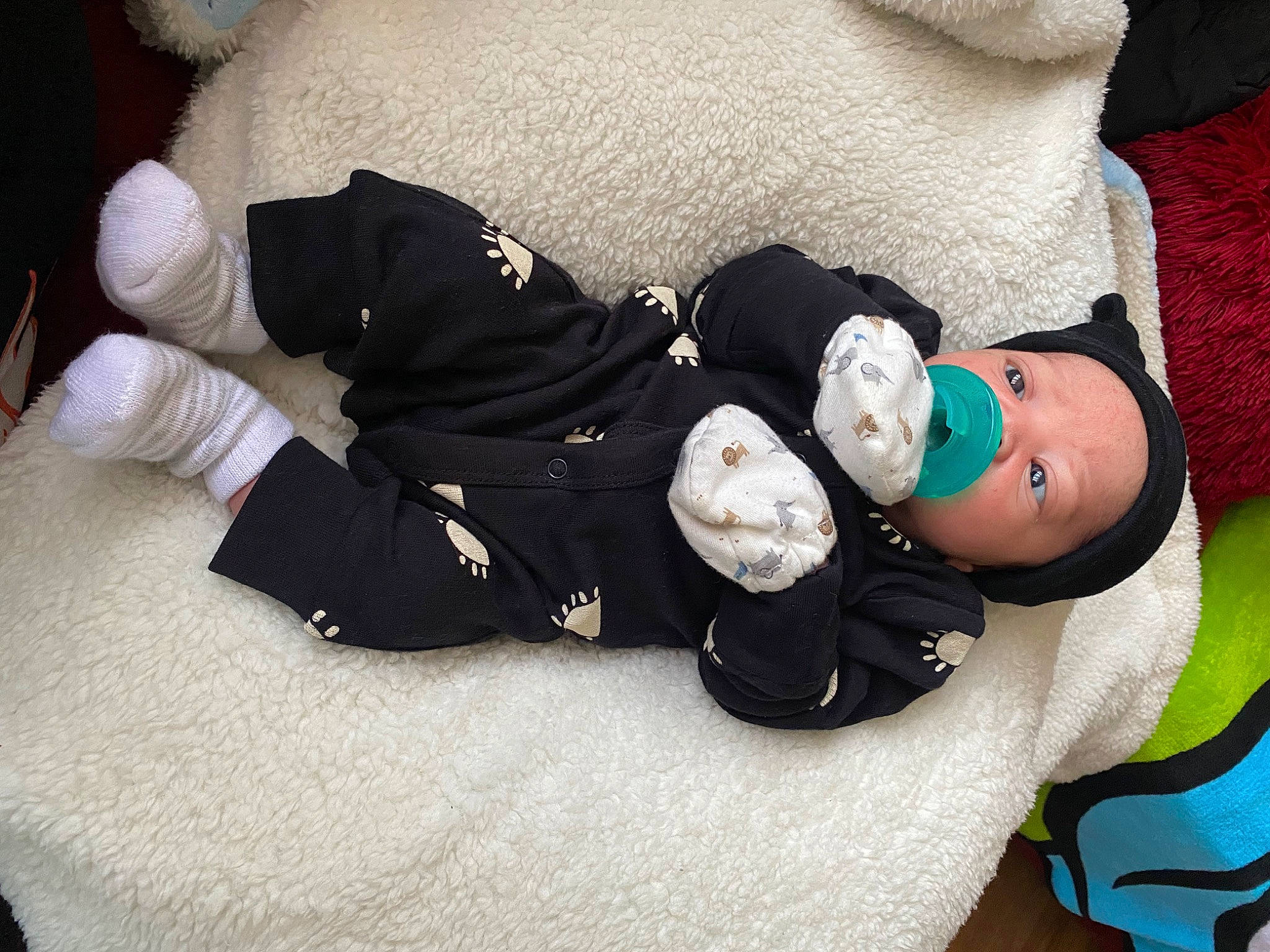 Gianni is registered to the contest to win money with this photo: arm, baby, baby_products, baby_toddler_clothing, comfort, doll, glasses, hat, head, human_body, knee, linens, person, personal_protective_equipment, plush, sleeve, sock, stuffed_toy, thigh, toddler