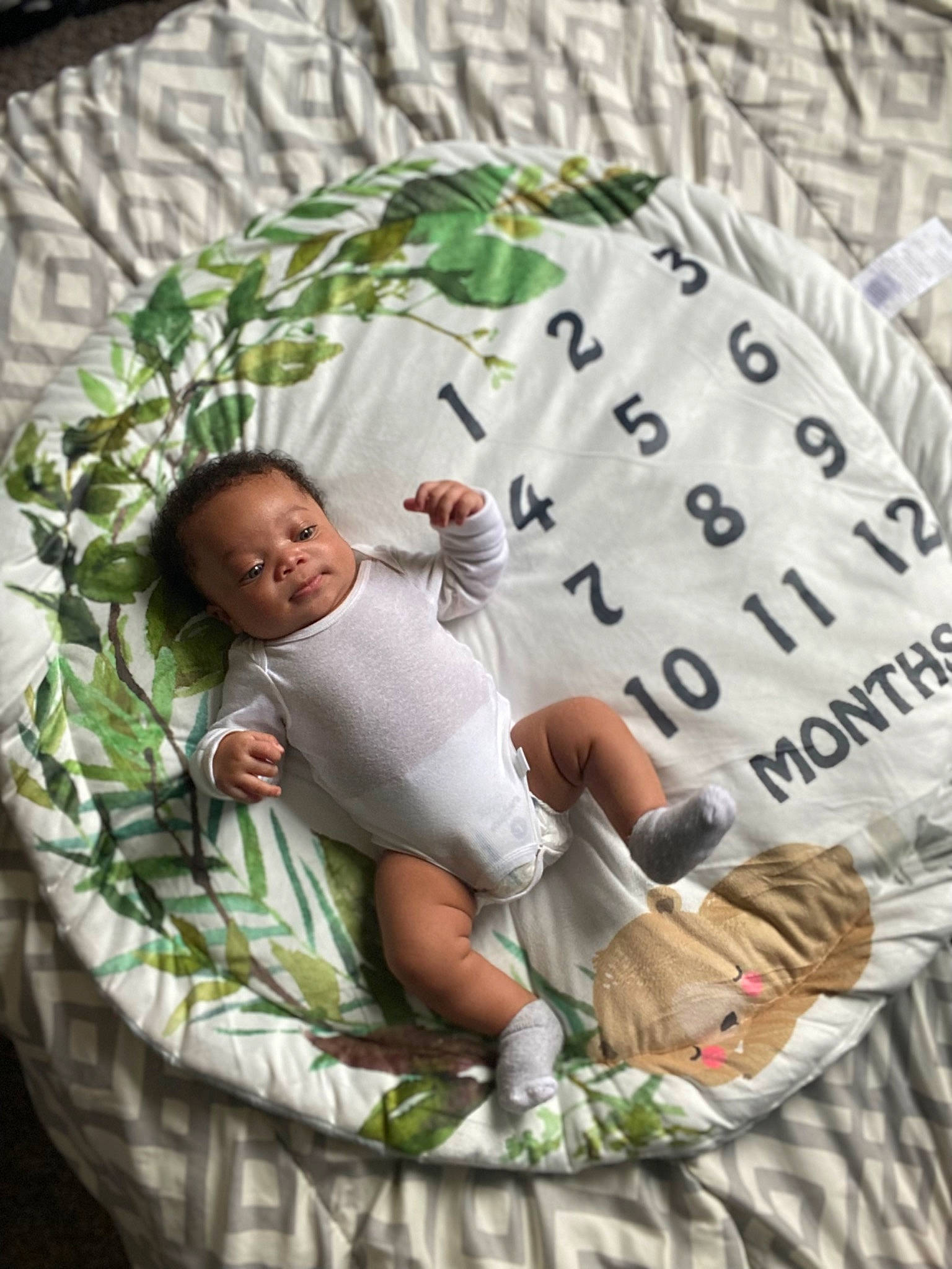 Gianni is registered to the contest to win money with this photo: baby, baby_toddler_clothing, bed, bedding, child, comfort, font, grass, happy, leisure, linens, mammal, pattern, person, pillow, shorts, sitting, sleeve, t_shirt, throw_pillow