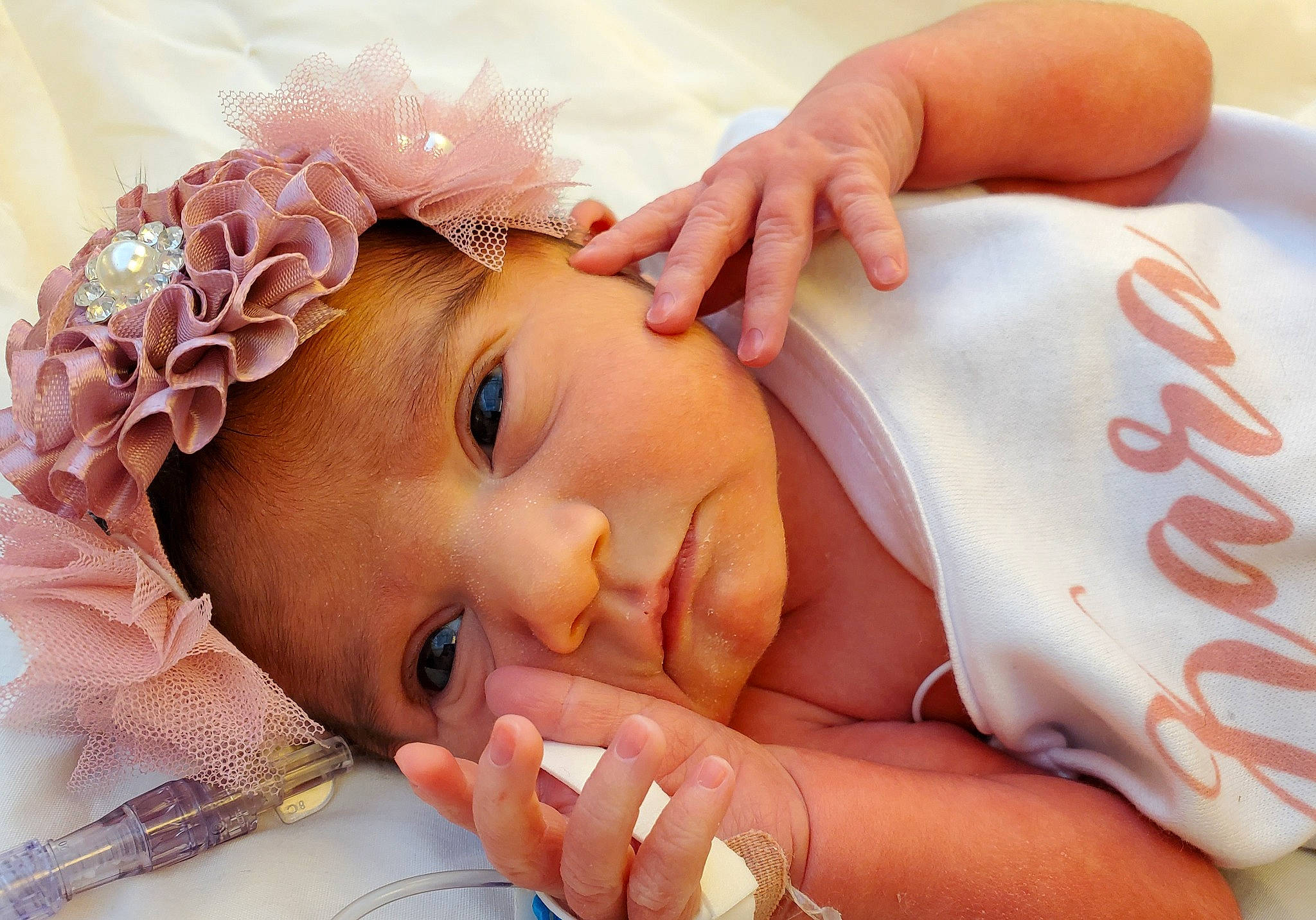 Kara joined the competition — help win amazing prizes! baby, baby_toddler_clothing, cheek, child, ear, eyelash, finger, gesture, hair, hand, happy, headpiece, lip, nail, nose, person, pink, skin, textile, thumb