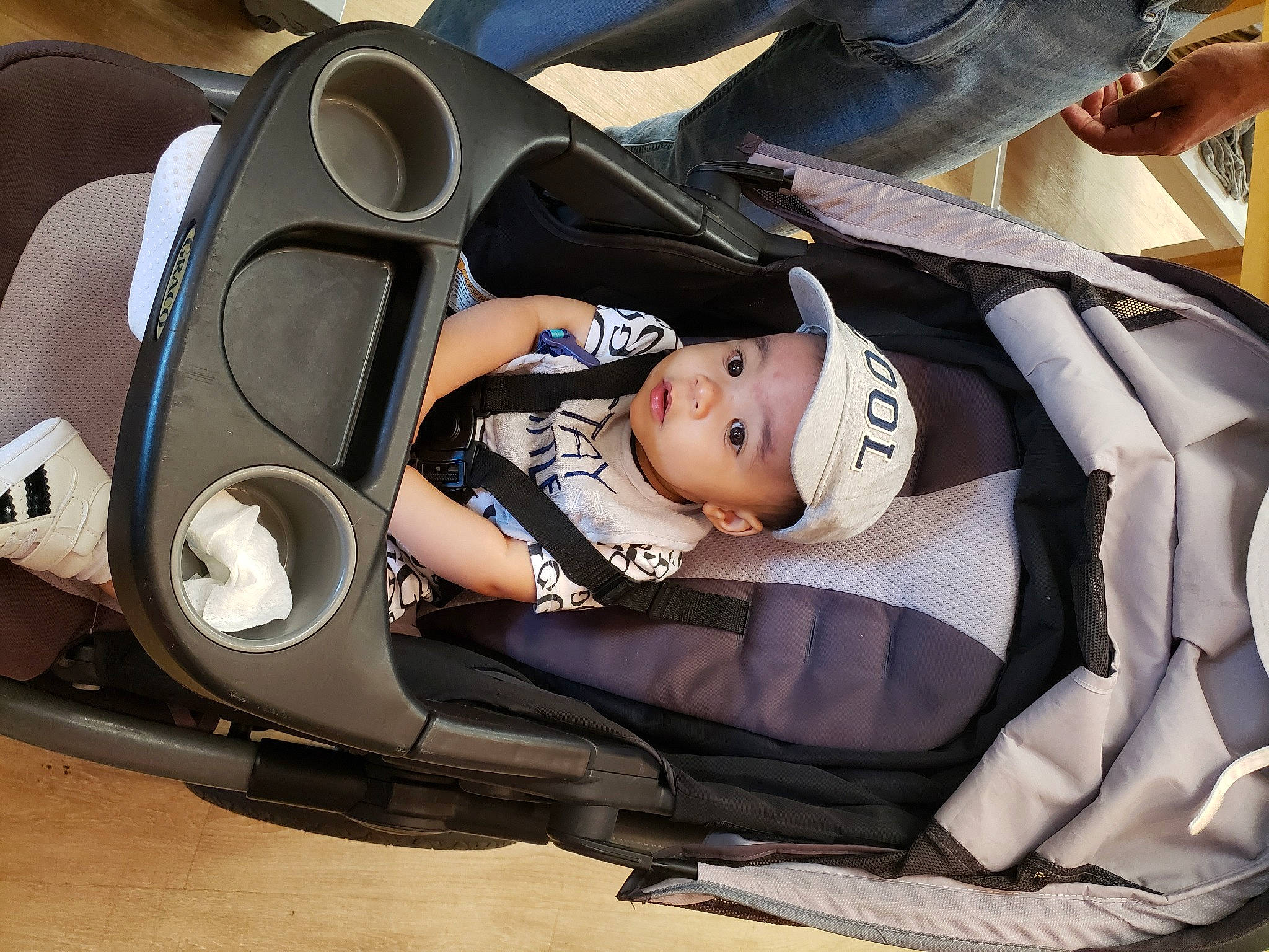 Roy is registered to the contest to win money with this photo: auto_part, automotive_design, automotive_exterior, automotive_tire, automotive_wheel_system, baby, baby_carriage, baby_in_car_seat, car_seat, car_seat_cover, comfort, headwear, motor_vehicle, person, personal_luxury_car, personal_protective_equipment, rim, tire, toddler, vehicle