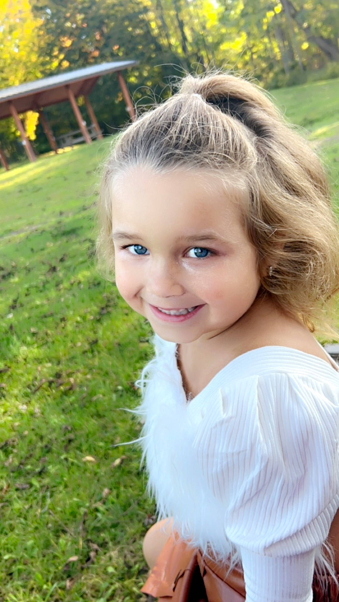 Alyvia is registered to the contest to win money with this photo: brown_hair, eye, face, flash_photography, fun, grass, grass_family, hair, happy, head, iris, joy, lip, long_hair, people_in_nature, person, plant, skin, smile, sunlight