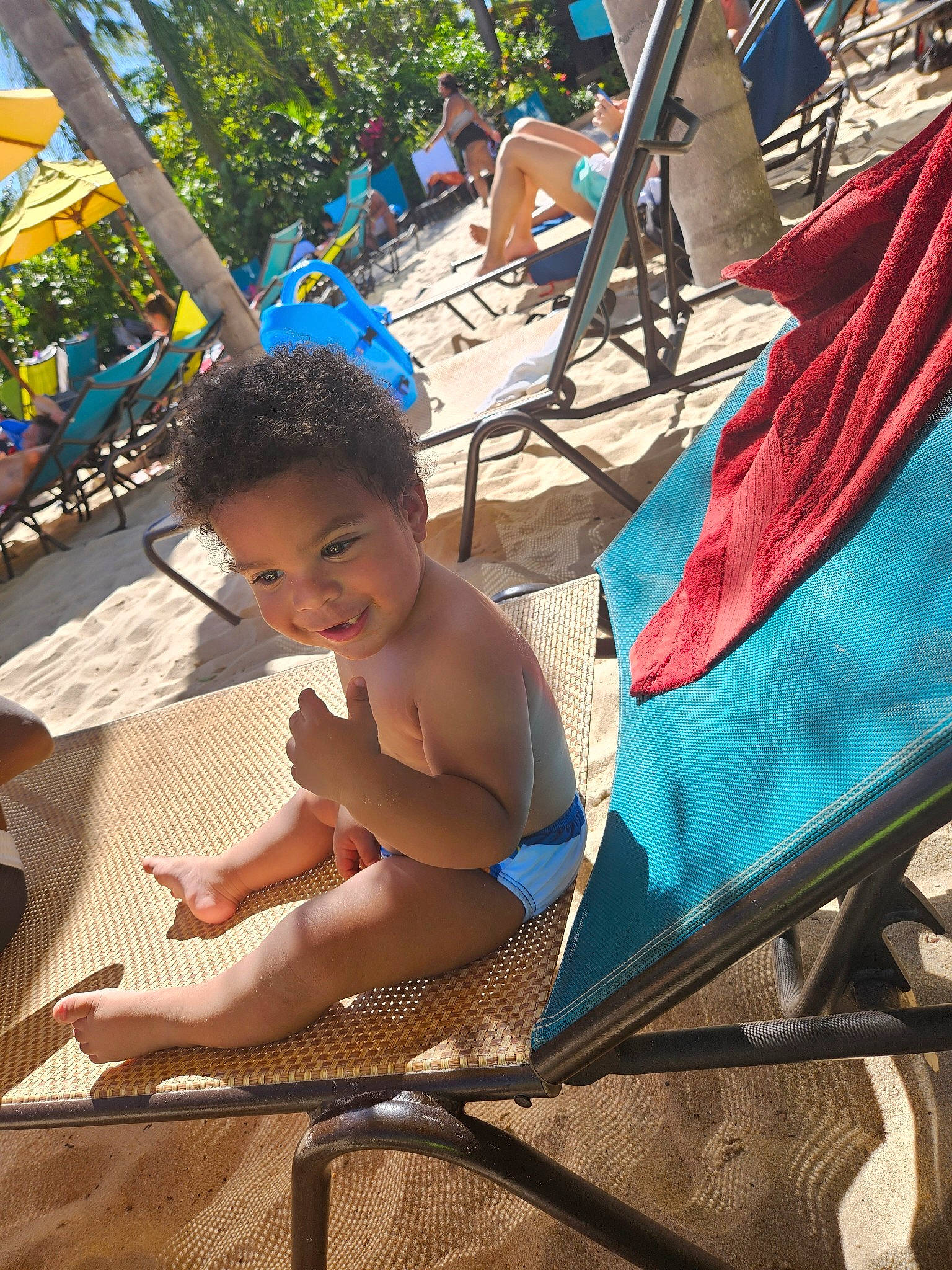 Royal is registered to the contest to win money with this photo: barechested, barefoot, blue, chair, event, foot, fun, leisure, outdoor_furniture, people_on_beach, person, recreation, shade, sitting, smile, summer, sun_tanning, sunlounger, toddler, travel