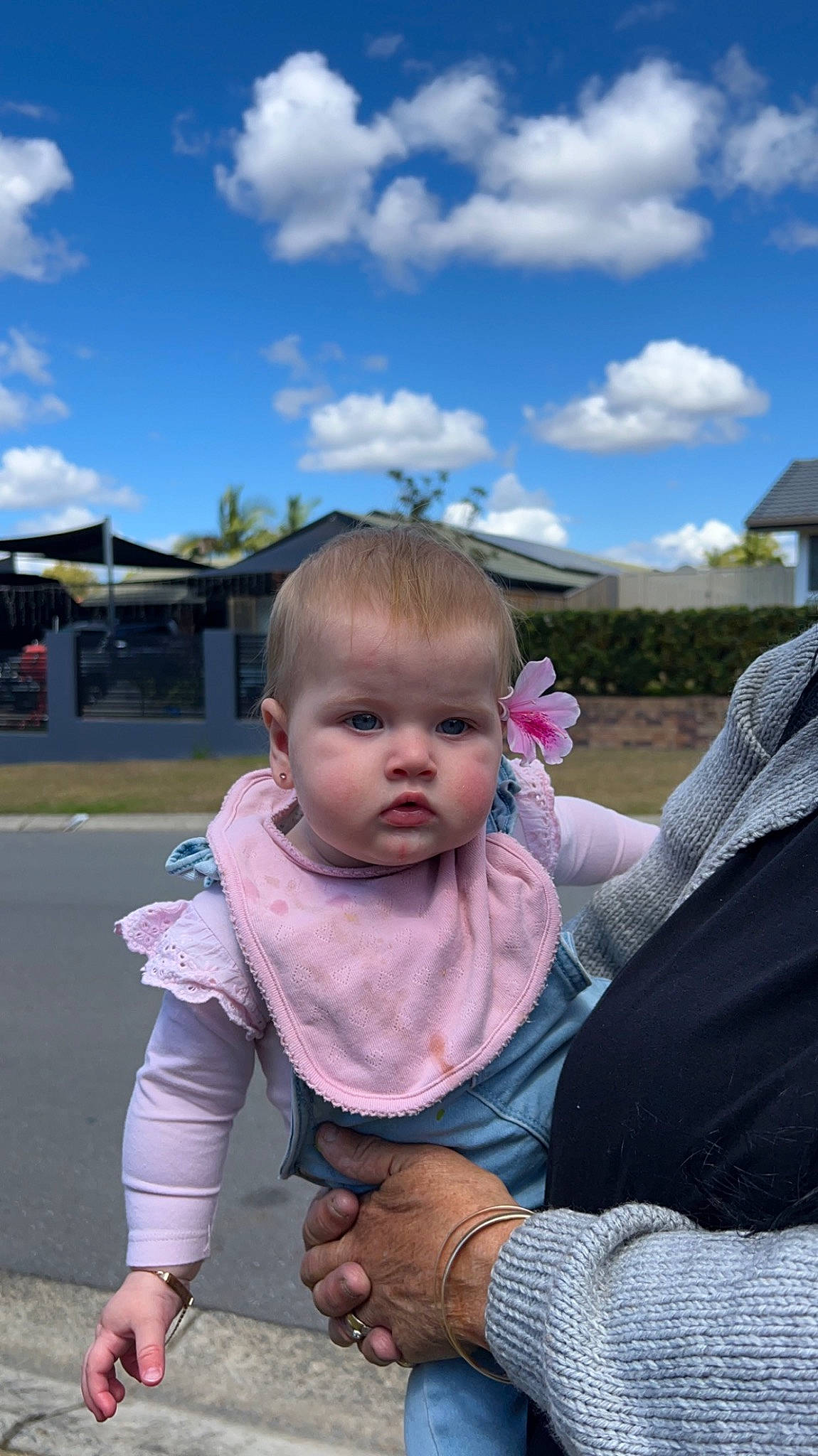 Macy is registered to the contest to win money with this photo: baby, baby_products, baby_toddler_clothing, child, cloud, face, fun, gesture, grass, happy, leisure, person, play, recreation, sitting, sky, toddler, tourism, tree, vacation