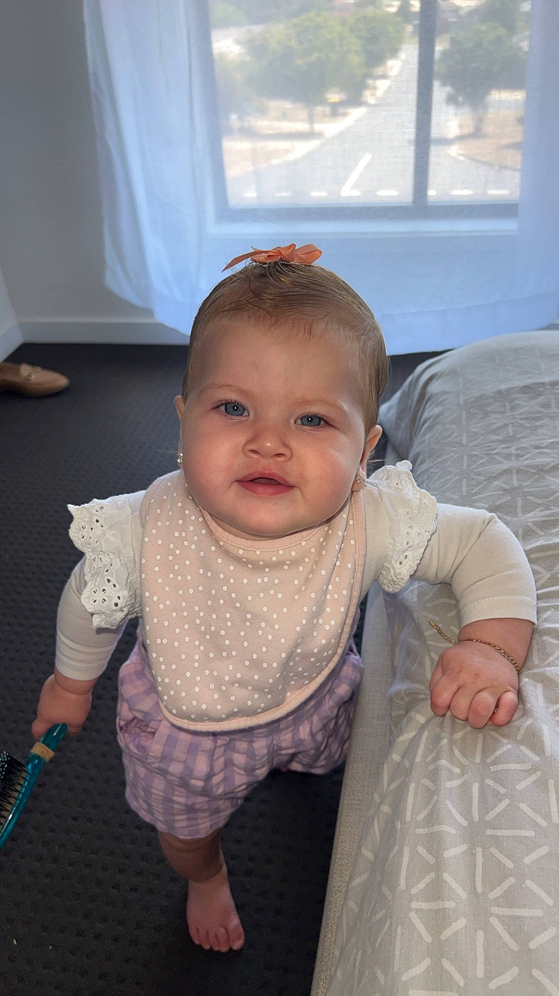 Macy is registered to the contest to win money with this photo: baby, baby_toddler_clothing, cheek, eye, finger, floor, flooring, hairstyle, hand, happy, human_body, iris, lip, mouth, neck, nose, person, shoulder, skin, sleeve