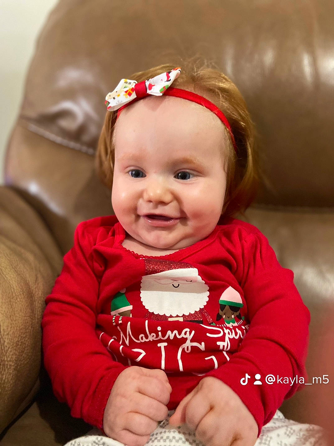 Kenleigh is registered to the contest to win money with this photo: baby, baby_toddler_clothing, cheek, child, comfort, costume_hat, eye, face, fashion_accessory, fun, happy, head, joy, lip, person, portrait_photography, sitting, skin, sleeve, smile