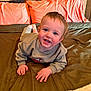 Elijah is registered to the contest to win money with this photo: baby, child, toddler, smile, teeth, bed, bedding, pillow, blanket, cute, indoors, portrait, hands, eyes, sweatshirt, crawling, happy, skin, hair, room