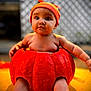 baby, pumpkin, orange, cute, hat, drool, child, fall, autumn, costume, outdoor, portrait, seasonal, cute_expression, sitting, skin, headwear, holiday, festive, background_blur