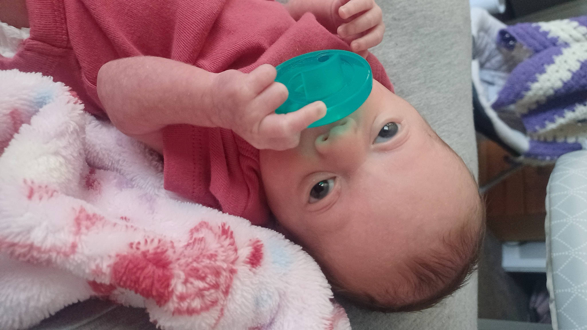 Myla is registered to the contest to win money with this photo: baby, baby_toddler_clothing, cap, cheek, child, eye, eyebrow, finger, gesture, happy, hat, headgear, human, lip, mouth, nose, person, pink, skin, textile