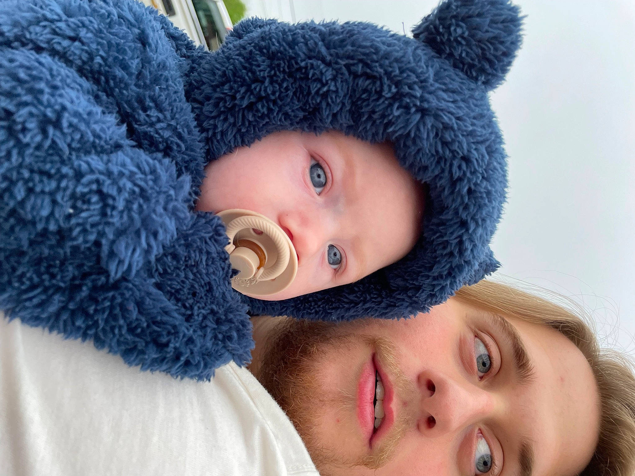 Maxton joined the competition — help win amazing prizes! blue, cap, ear, eye, eyelash, face, happy, hat, head, headgear, headwear, human_body, lip, nose, organ, outerwear, person, skin, toddler, tree
