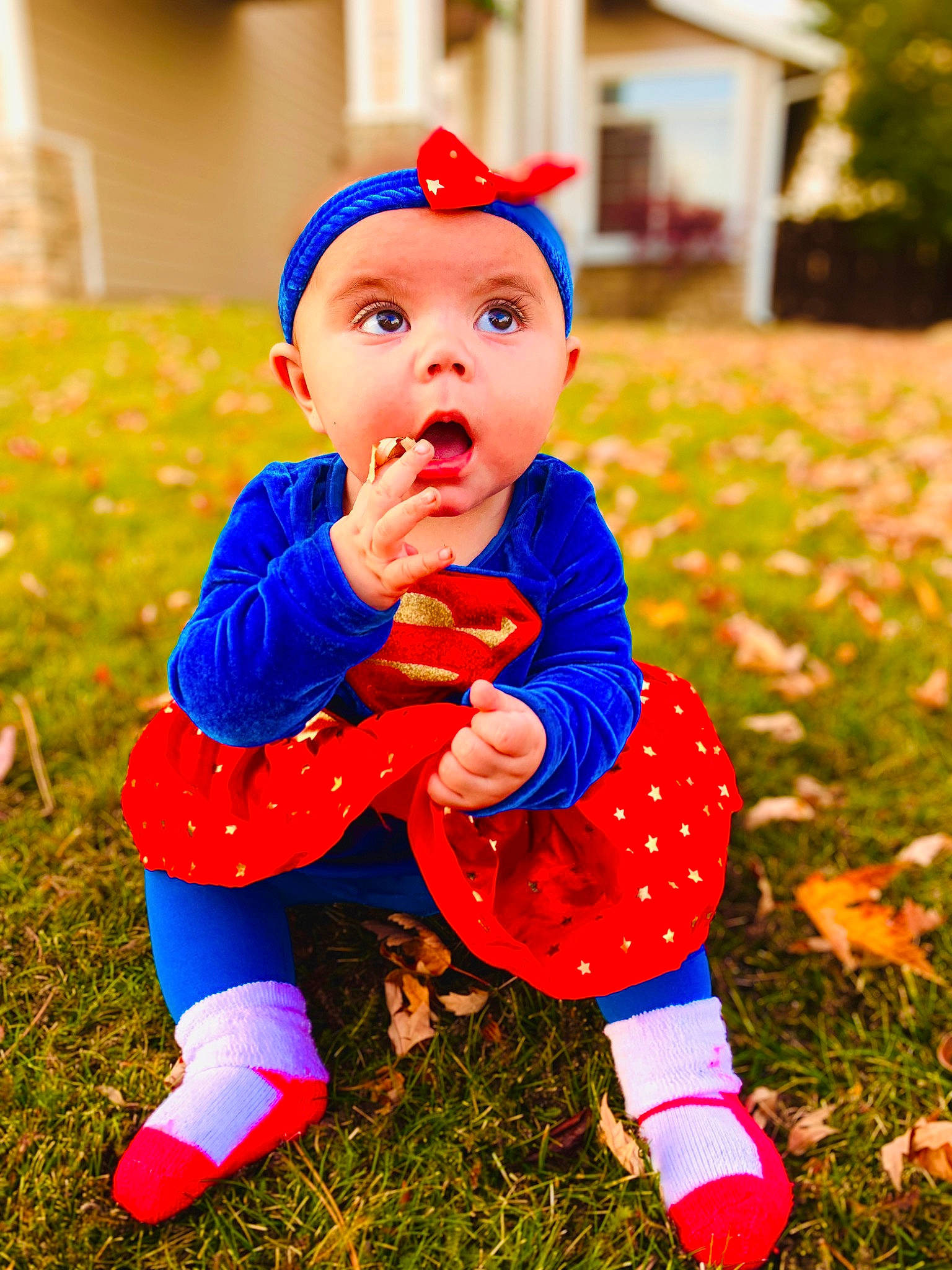 Zaryah is registered to the contest to win money with this photo: baby, baby_toddler_clothing, ball, child, electric_blue, facial_expression, fictional_character, fun, grass, happy, leaf, orange, people_in_nature, person, plant, play, playing_with_kids, sitting, smile, standing
