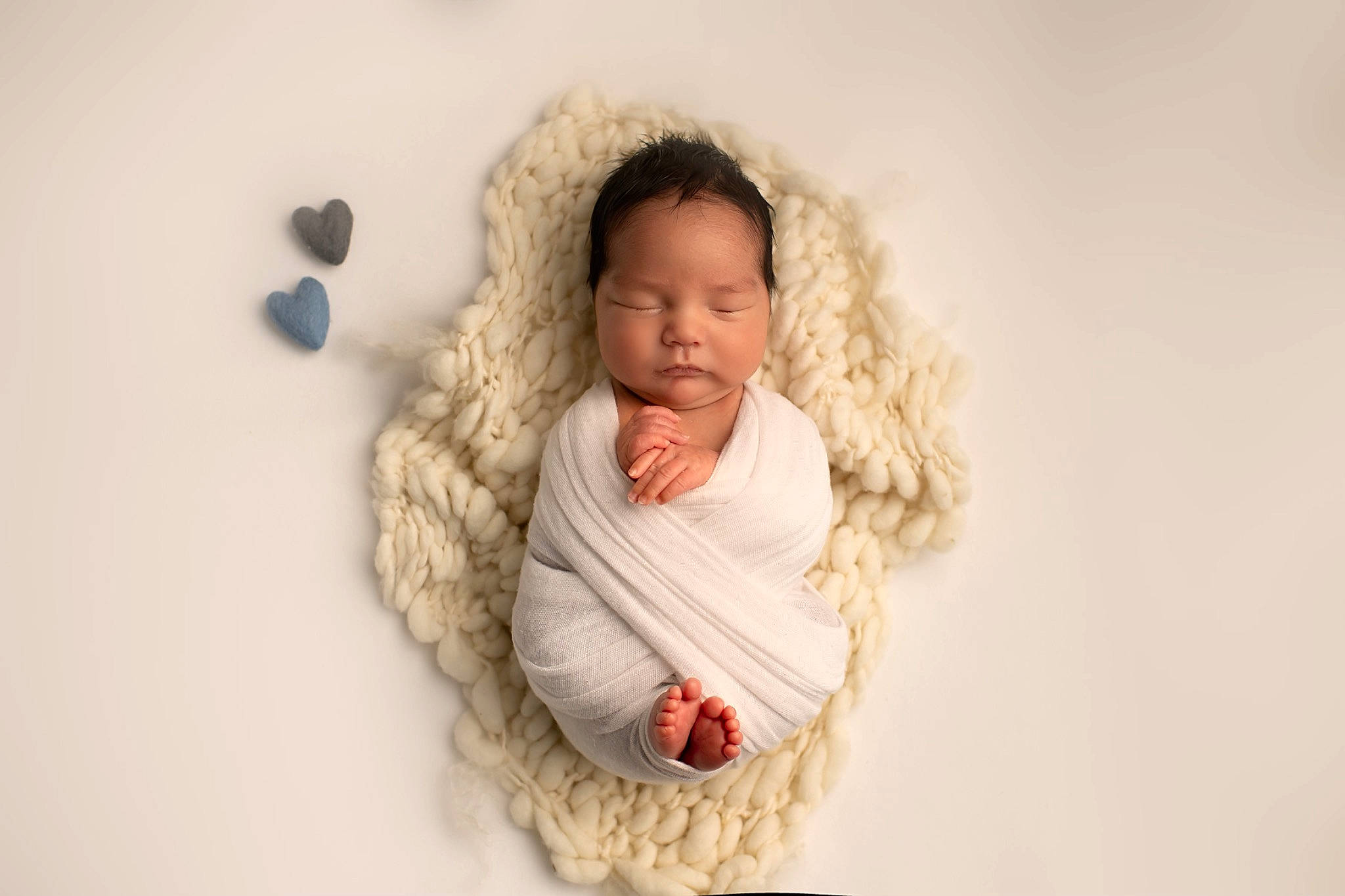 Logan is registered to the contest to win money with this photo: baby, child, comfort, fashion_accessory, fur, fur_clothing, hair, happy, jacket, linens, person, portrait, portrait_photography, room, sitting, sleeve, toddler, winter, wood, wool