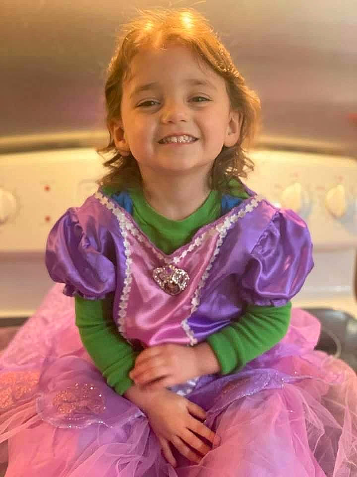 Kendall is registered to the contest to win money with this photo: child, costume, embellishment, event, face, fashion_accessory, fashion_design, fun, hairstyle, happy, iris, jewellery, joy, magenta, person, pink, purple, sitting, skin, sleeve