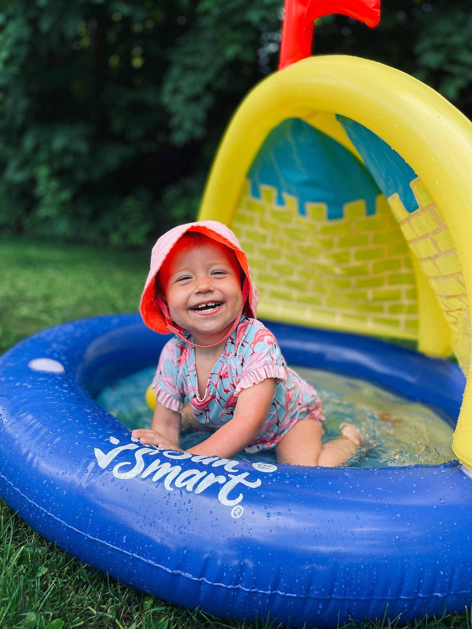 Brinley joined the competition — help win amazing prizes! aqua, automotive_tire, baby_toddler_clothing, child, chute, electric_blue, fun, grass, happy, headwear, inflatable, joy, leisure, person, photograph, play, playground, product, recreation, smile