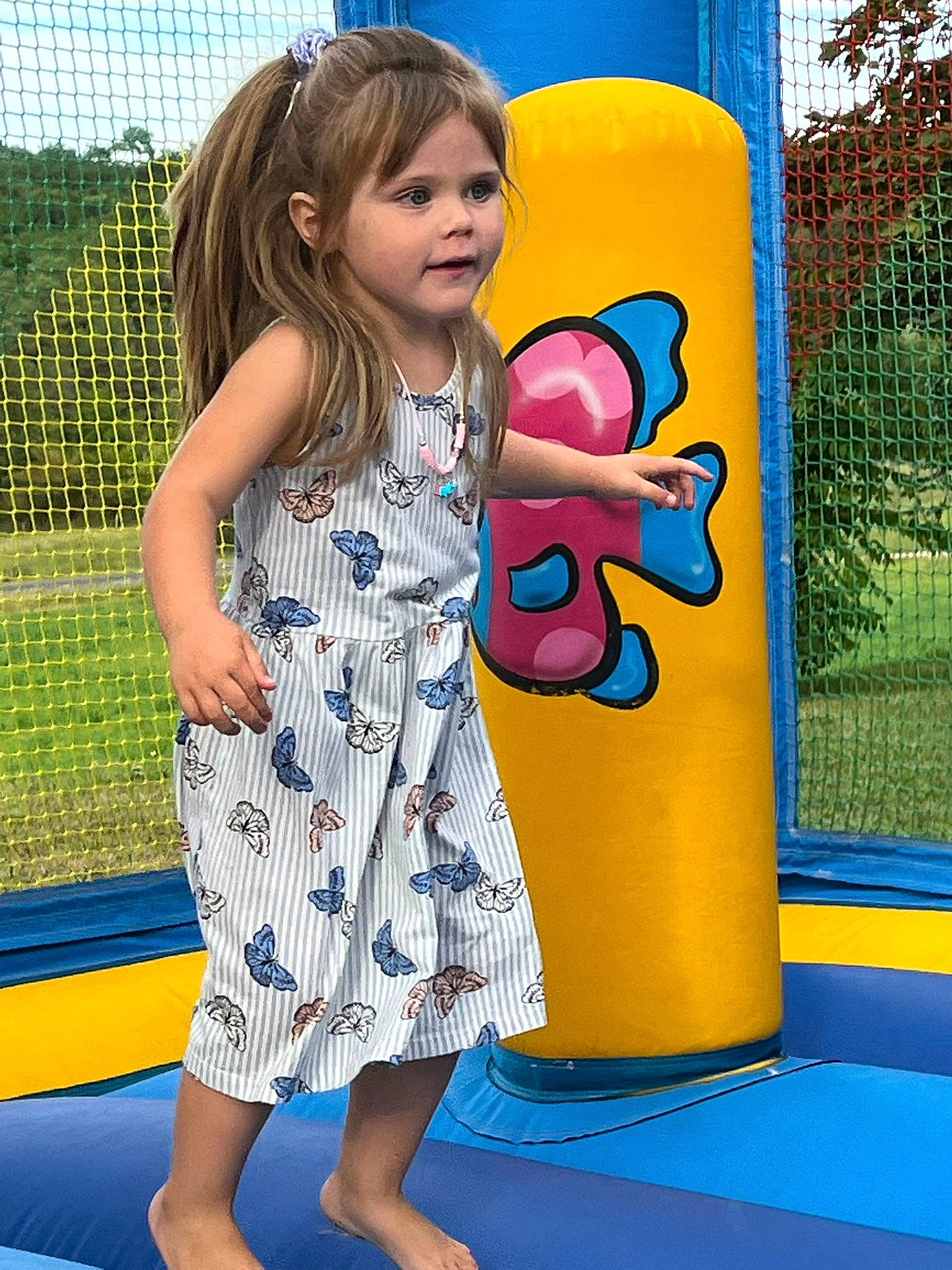 Gaïa participe au concours pour gagner de l'argent avec cette photo : blue, day_dress, dress, electric_blue, fun, gesture, hairstyle, hand, happy, leisure, one_piece_garment, pattern, person, photograph, recreation, snapshot, summer, thigh, toddler, waist