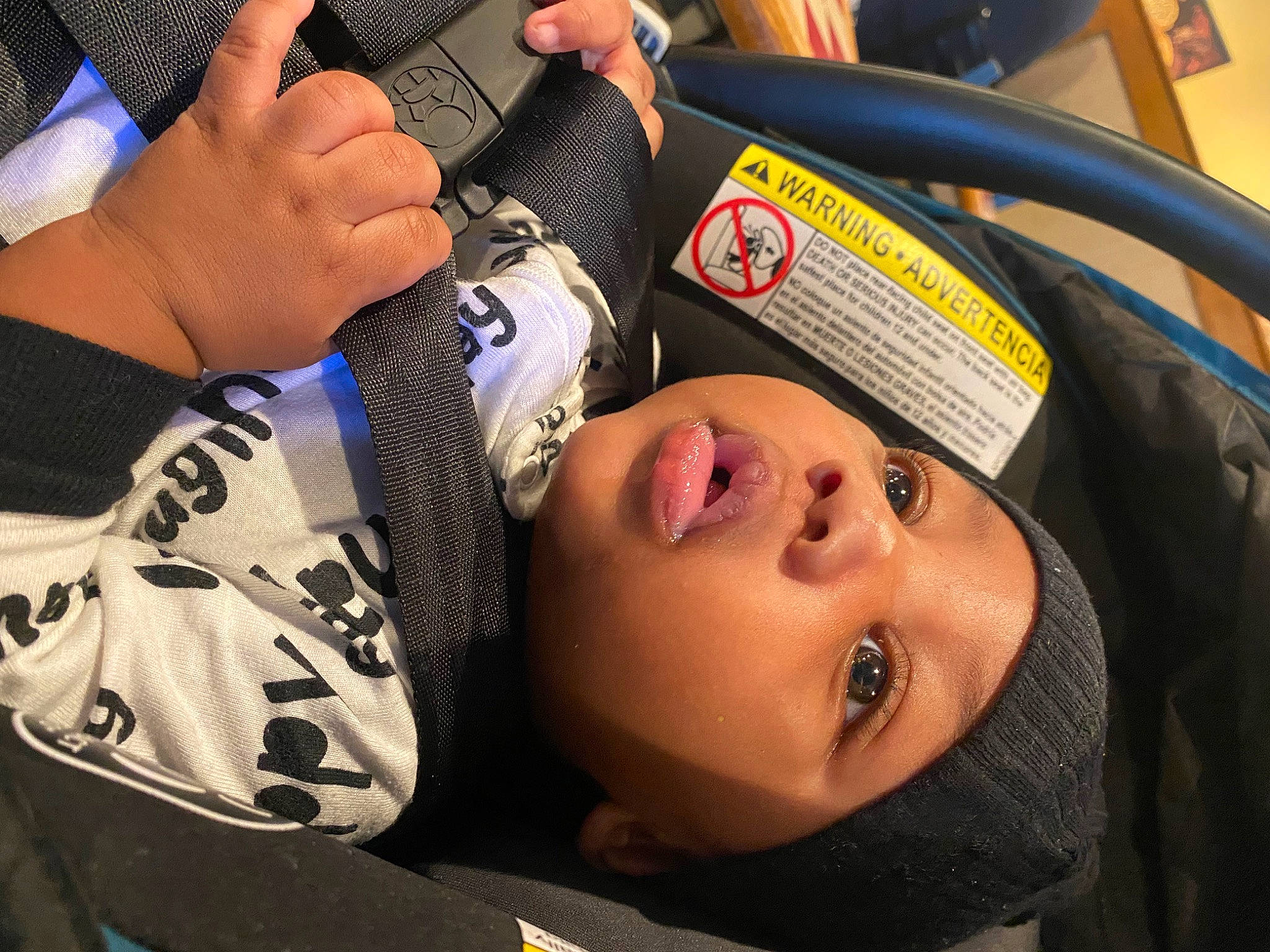 Juelz is registered to the contest to win money with this photo: audio_equipment, baby_products, child, comfort, competition_event, contact_sport, elbow, eyelash, eyewear, fashion_accessory, gesture, grappling, hand, headgear, headwear, human_leg, nail, person, personal_protective_equipment, sports_gear