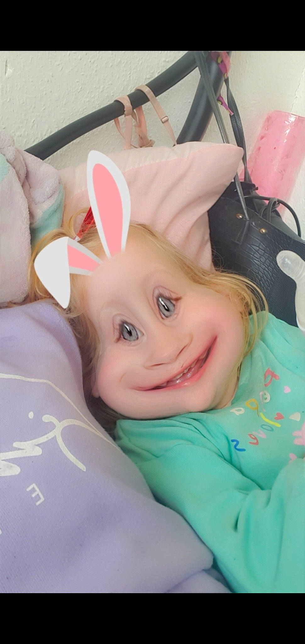 Crystal is registered to the contest to win money with this photo: auto_part, baby, baby_products, cap, car_seat, child, comfort, costume_hat, eye, eyebrow, eyelash, fashion_accessory, fun, happy, linens, person, pink, skin, smile, steering_wheel