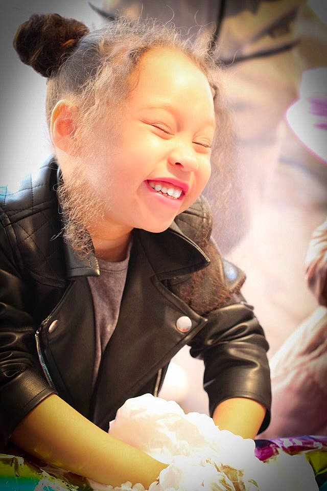 Nylah joined the competition — help win amazing prizes! baby, child, event, fashion_accessory, flash_photography, fun, glove, happy, iris, jewellery, joy, laugh, leisure, necklace, person, portrait_photography, sitting, skin, smile, snapshot