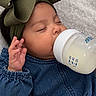 Melody joined the competition — help win amazing prizes! baby, infant, sleeping, bottle, feeding, milk, bow, headband, denim, jacket, hand, closed_eyes, portrait, indoor, blanket, lying_down, peaceful, child, fashion, photography