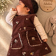 Melody joined the competition — help win amazing prizes! baby, infant, sleeping, portrait, indoor, laying_down, corduroy, dress, headband, socks, floral_pattern, embroidered_clothing, plush_toy, bunny, flowers, wooden_sign, name plaque, cozy, blanket, photography