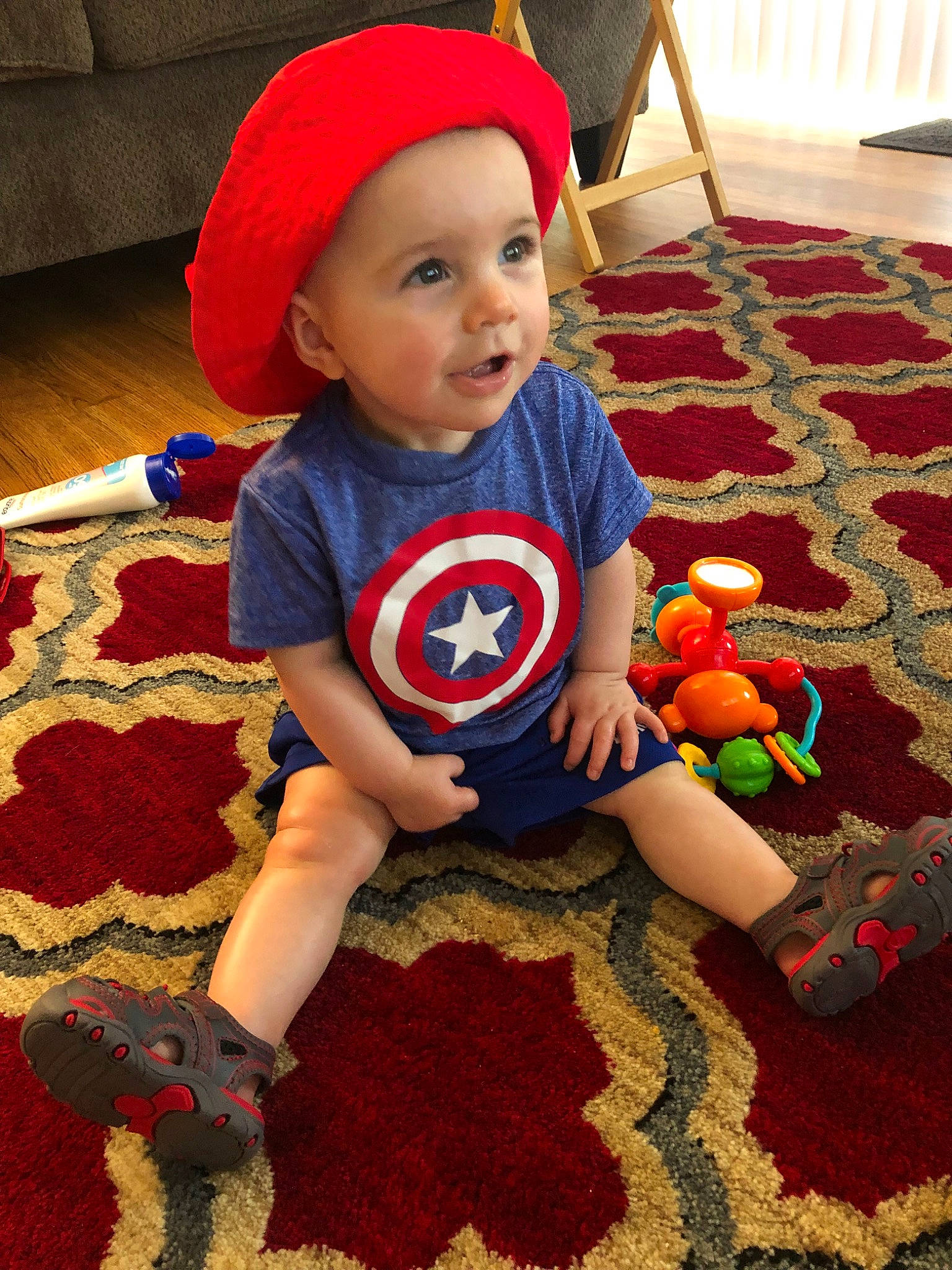 Caspian joined the competition — help win amazing prizes! baby, captain_america, carpet, child, costume, crochet, fictional_character, headgear, outerwear, person, play, red, spider_man, superhero, t_shirt, textile, toddler