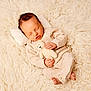 newborn, baby, sleeping, knitwear, teddy_bear, plush, soft, cozy, infant, cute, peaceful, blanket, texture, child, resting, pillow, warm, homedecor, portrait, indoors