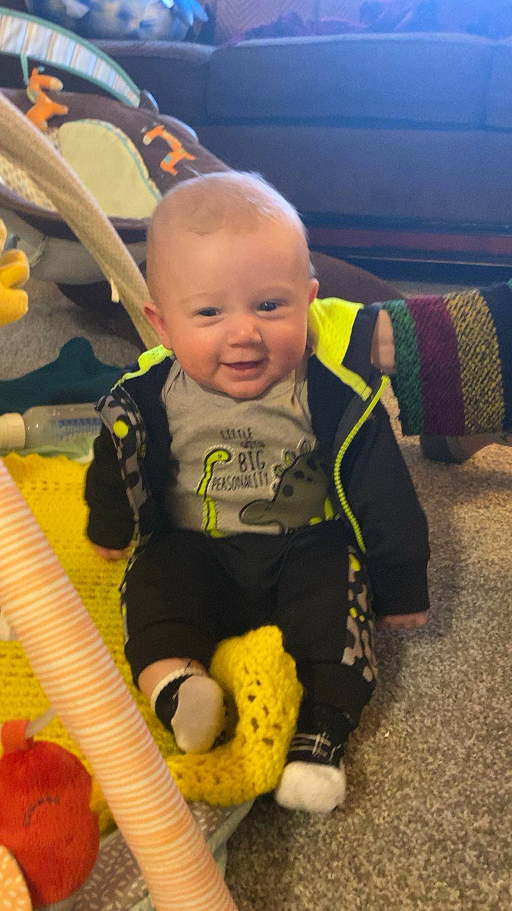 Carter joined the competition — help win amazing prizes! baby, baby_products, baby_toddler_clothing, baby_toys, cheek, child, eye, facial_expression, fun, happy, head, joy, person, play, room, sitting, skin, smile, stuffed_toy, toddler