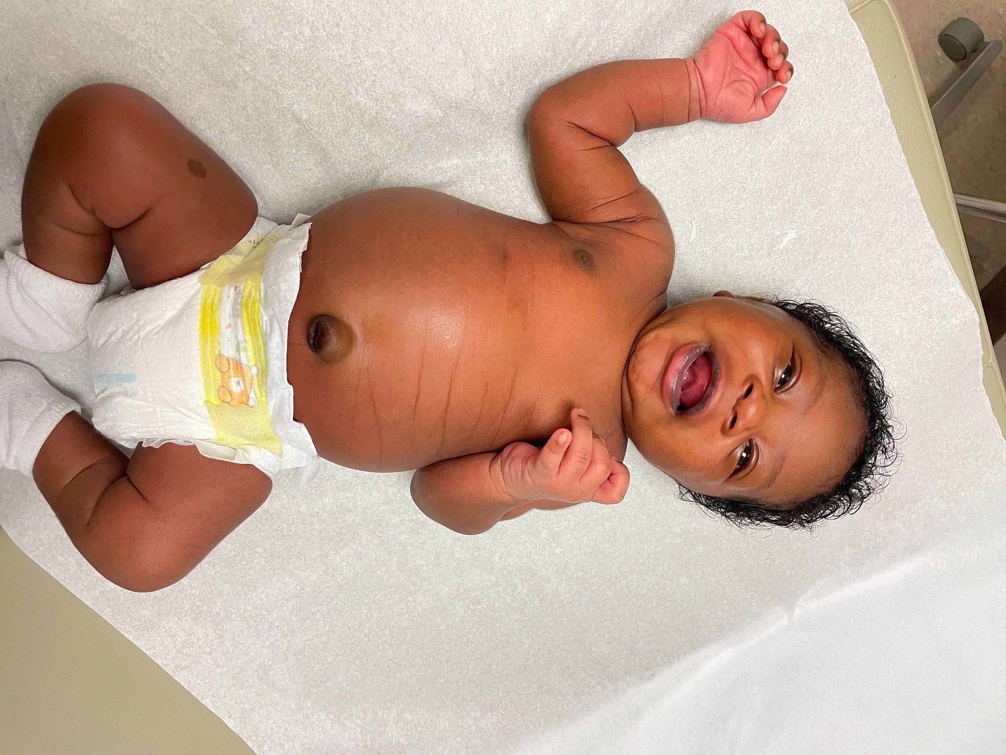 Dakari is registered to the contest to win money with this photo: abdomen, baby, brassiere, chest, child, comfort, diaper, elbow, joint, knee, muscle, navel, person, skin, smile, stomach, swimwear, thigh, toddler, trunk