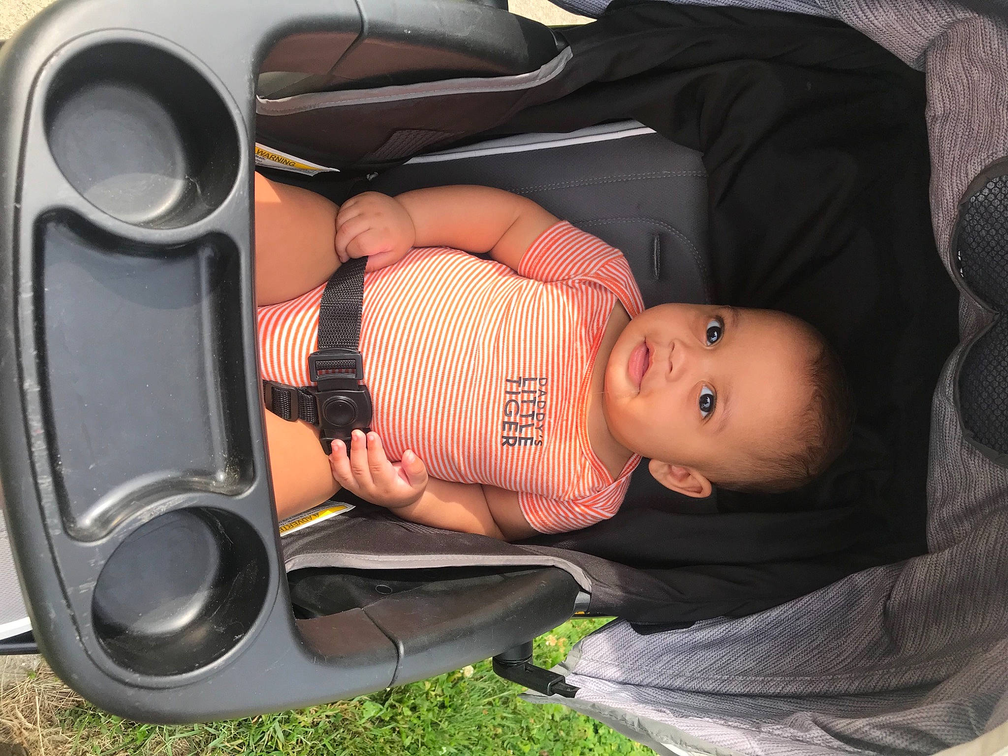 Kalvin joined the competition — help win amazing prizes! audio_equipment, auto_part, automotive_design, automotive_lighting, automotive_tire, baby, baby_carriage, baby_toddler_clothing, car_seat, child, comfort, fender, grass, headgear, mammal, motor_vehicle, person, product, toddler, vehicle