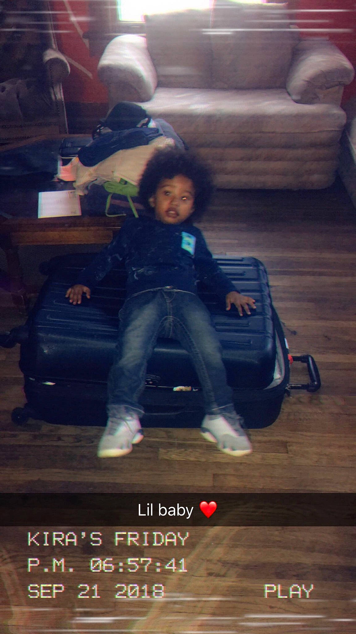 Dash is registered to the contest to win money with this photo: child, family_car, furniture, person, photo_caption, photography, sitting, sky