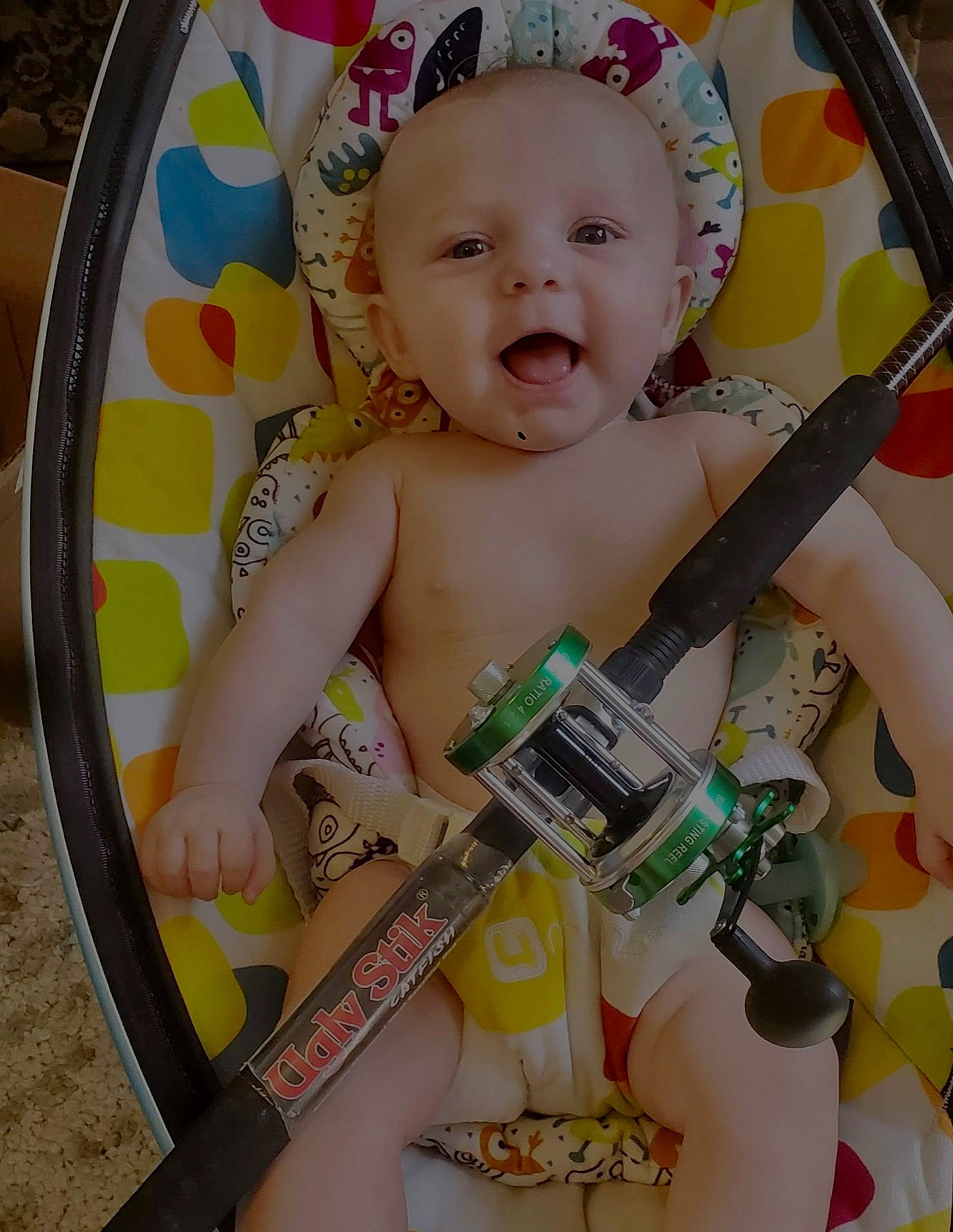 Maximus is registered to the contest to win money with this photo: baby, baby_products, baby_safety, baby_toddler_clothing, baby_toys, box, cheek, chest, child, circle, dishware, eyelash, happy, person, photo_caption, play, sitting, smile, toddler, visual_arts