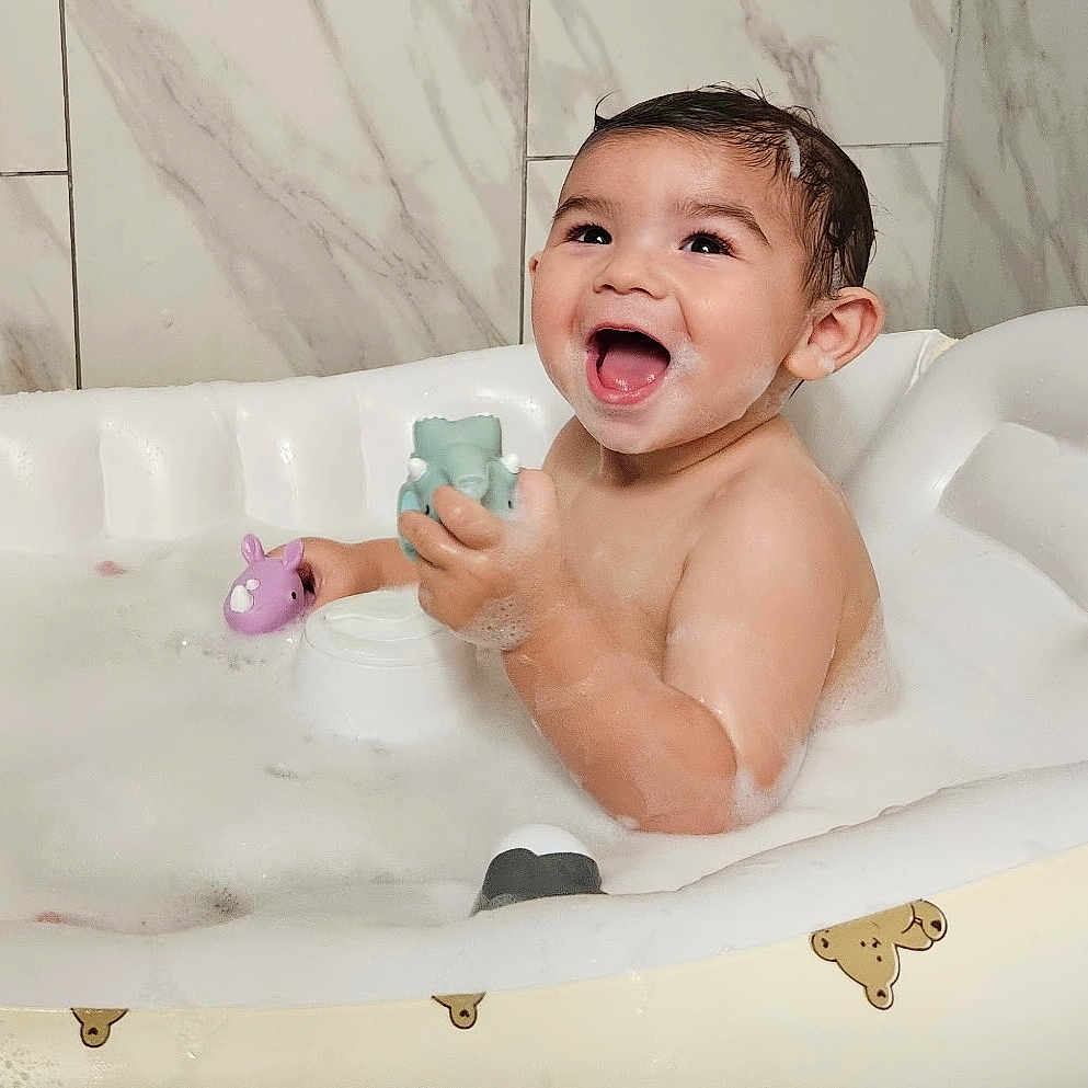 Jaxen is registered to the contest to win money with this photo: baby, bath, bathroom, bathtub, bubbles, child, childhood, cute, foam, fun, happy, infant, inflatable, playing, skin, smile, teddy_bear, toy, water, wet