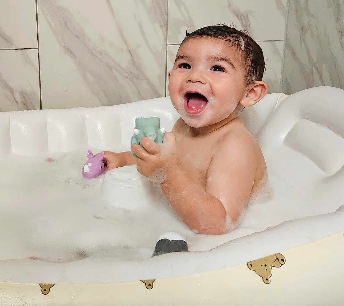 Jaxen is registered to the contest to win money with this photo: baby, bath, bathroom, bathtub, bubbles, child, childhood, cute, foam, fun, happy, infant, inflatable, playing, skin, smile, teddy_bear, toy, water, wet