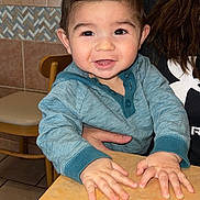 Jaxen joined the competition — help win amazing prizes! adult_hand, baby, blue_hoodie, casual, chair, child, cute, eyes, face, hair, hands, happy, indoor, kitchen, person, portrait, smiling, table, tile_wall, toddler