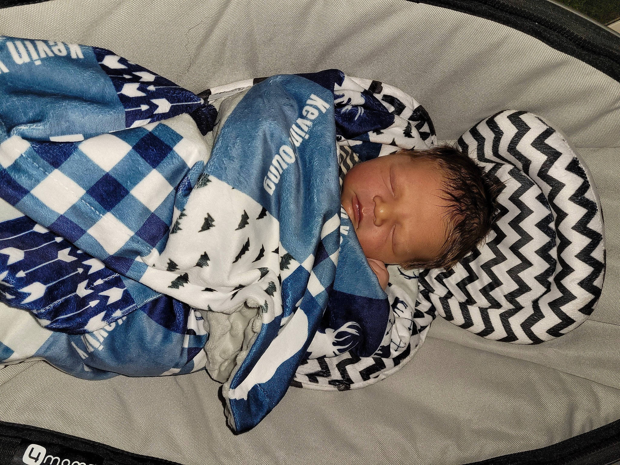 Kevin joined the competition — help win amazing prizes! baby, baby_products, baby_sleeping, baby_toddler_clothing, child, comfort, couch, electric_blue, fashion_accessory, linens, nap, pattern, person, plaid, room, sitting, sleeve, t_shirt, tartan, textile