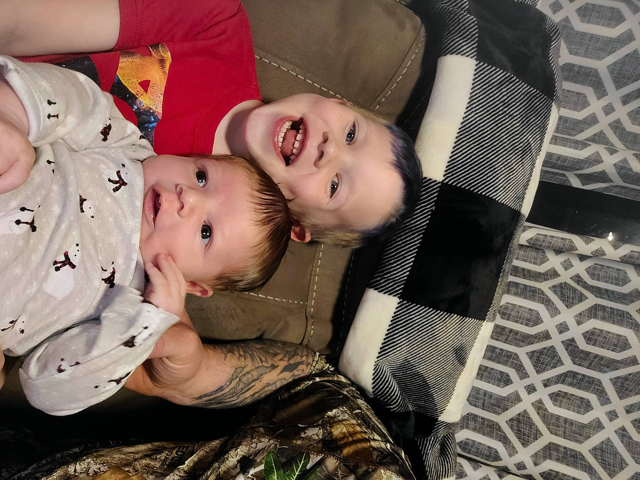 Kevin is registered to the contest to win money with this photo: baby, baby_toddler_clothing, cheek, child, comfort, eye, face, flash_photography, grass, happy, human, pattern, person, sitting, skin, sleeve, smile, textile, toddler, tree