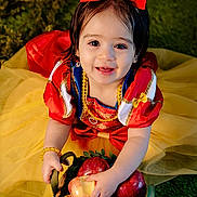 Allison joined the competition — help win amazing prizes! child, toddler, smiling, red_bow, snow_white_costume, apples, basket, yellow_skirt, green_grass, portrait, cute, outdoor, happy, face, person, costume, dress, playful, bright_colors, cute_expression