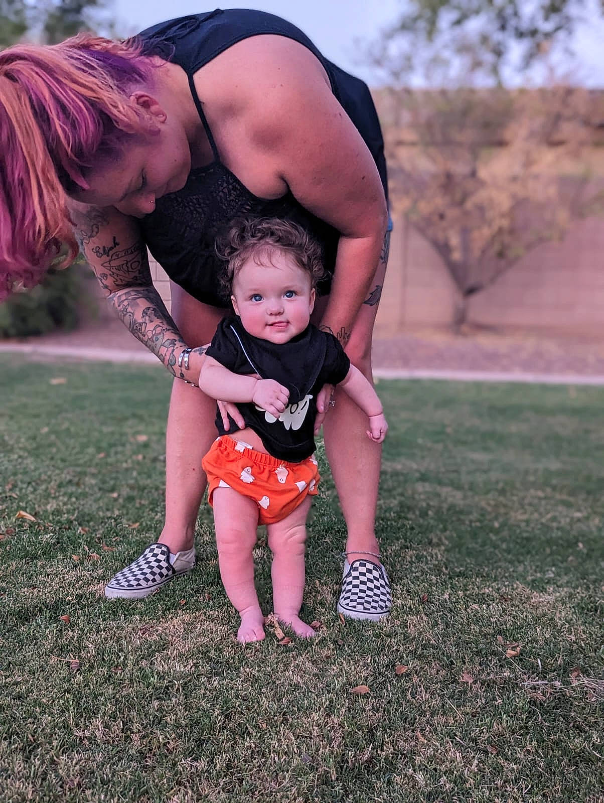 Lydia is registered to the contest to win money with this photo: arm, baby, barefoot, child, flash_photography, foot, fun, gesture, grass, grassland, happy, human_leg, leg, leisure, people_in_nature, person, sitting, sky, soil, thigh