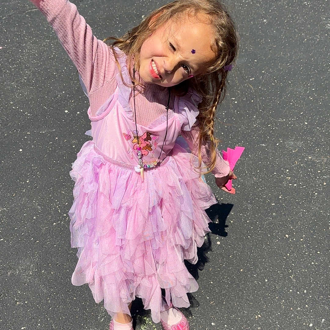 Harmoney joined the competition — help win amazing prizes! asphalt, braided_hair, child, clothing, cute, daytime, footwear, fun, girl, happy, necklace, outdoor, people, pink_dress, play, playground, shadow, shoes, smiling, sunny