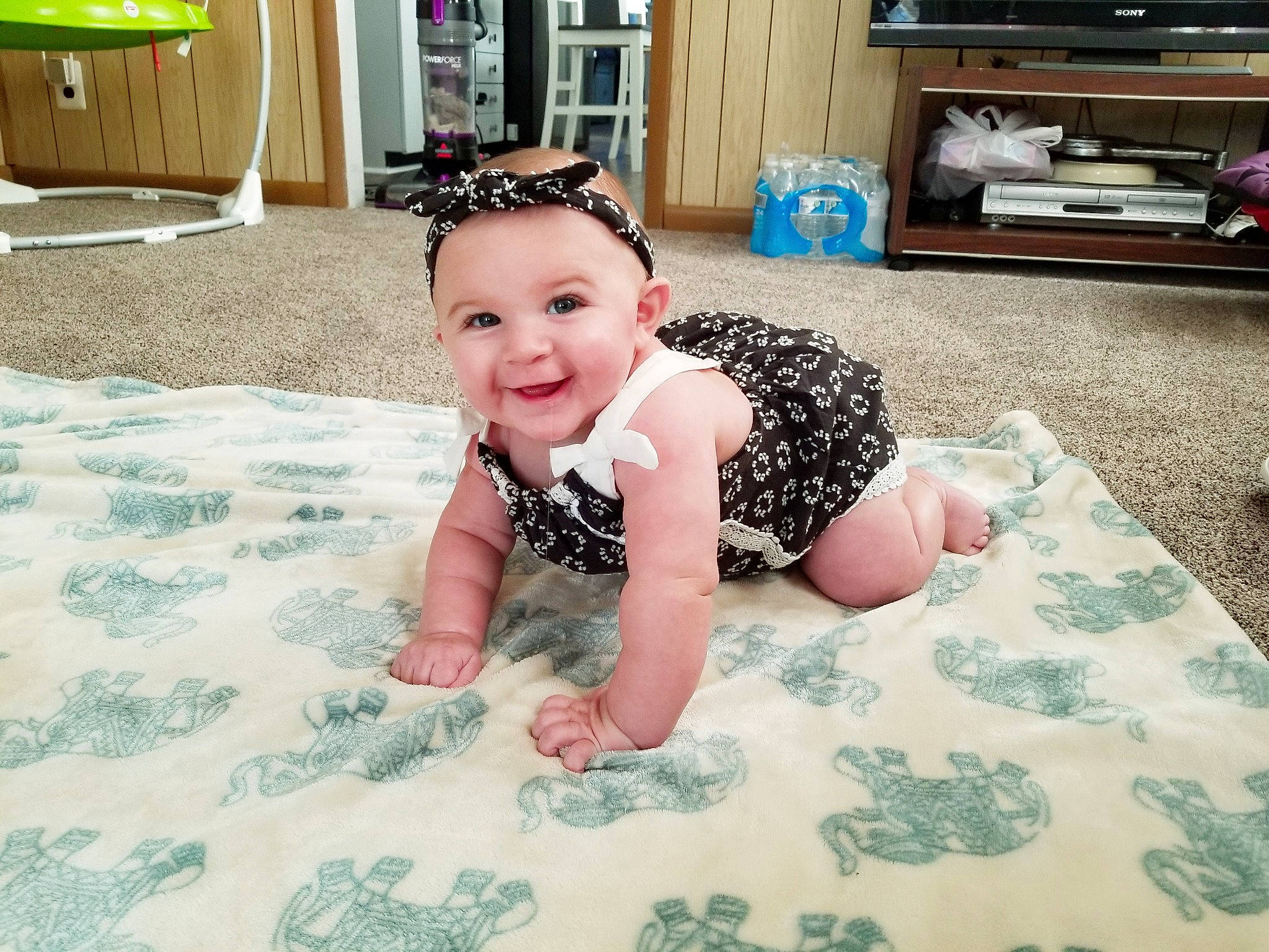 Gianna is registered to the contest to win money with this photo: child, day, floor, flooring, fun, girl, infant, joy, pattern, person, play, skin, textile, toddler, vacation