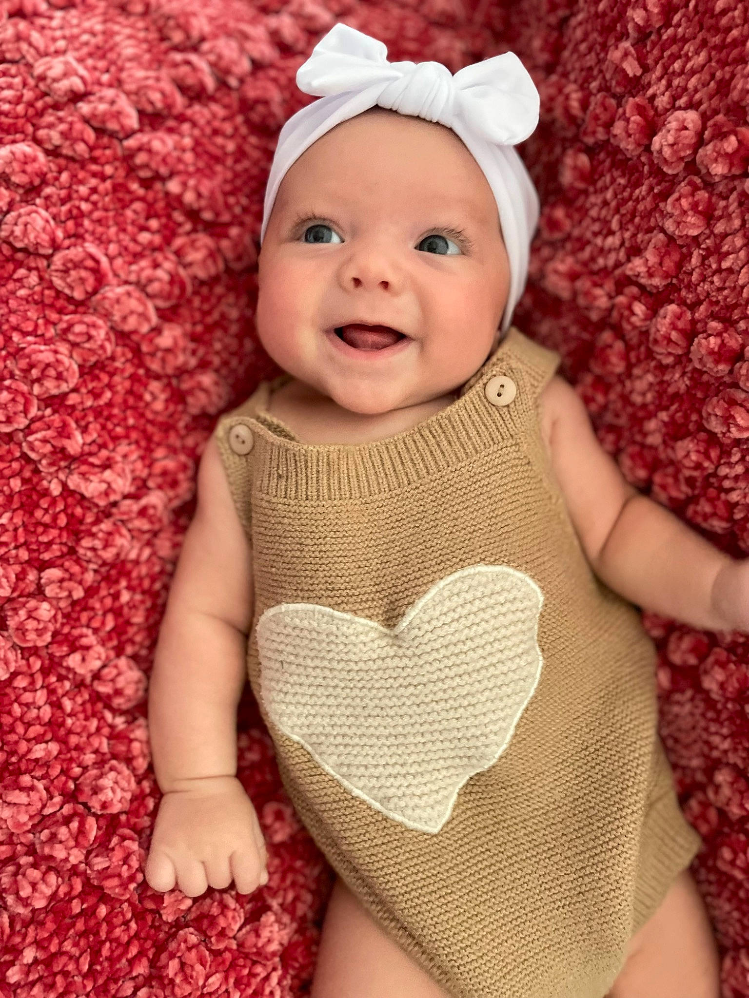 Lainey is registered to the contest to win money with this photo: baby, baby_toddler_clothing, beauty, cap, child, face, fashion_accessory, happy, headgear, headwear, joy, lip, magenta, pattern, person, pink, skin, sleeve, smile, textile