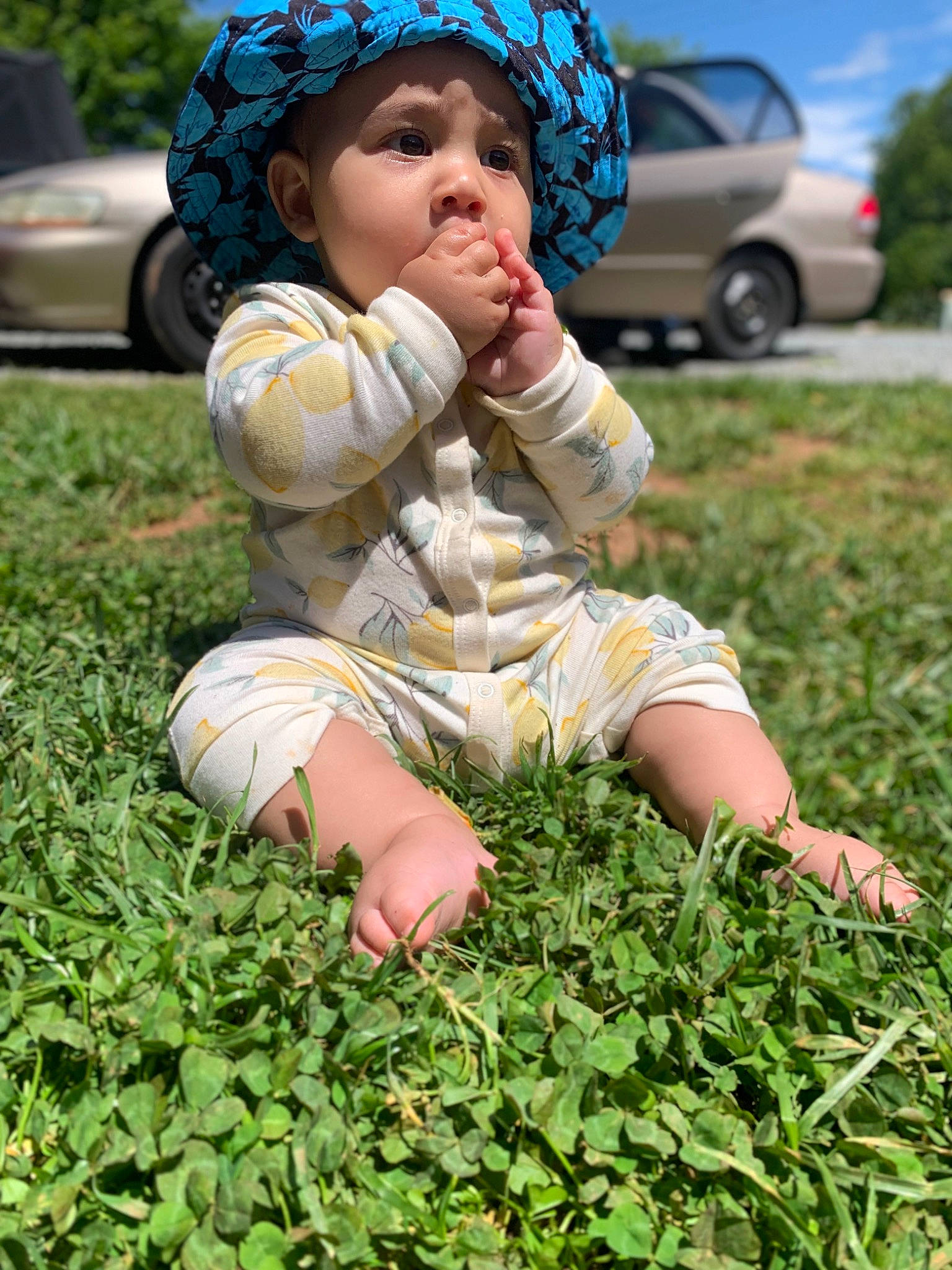 Khalil joined the competition — help win amazing prizes! baby, baby_toddler_clothing, cap, car, child, fun, grass, grass_family, groundcover, happy, hat, headwear, human_leg, lawn, people_in_nature, person, plant, soil, thigh, tire