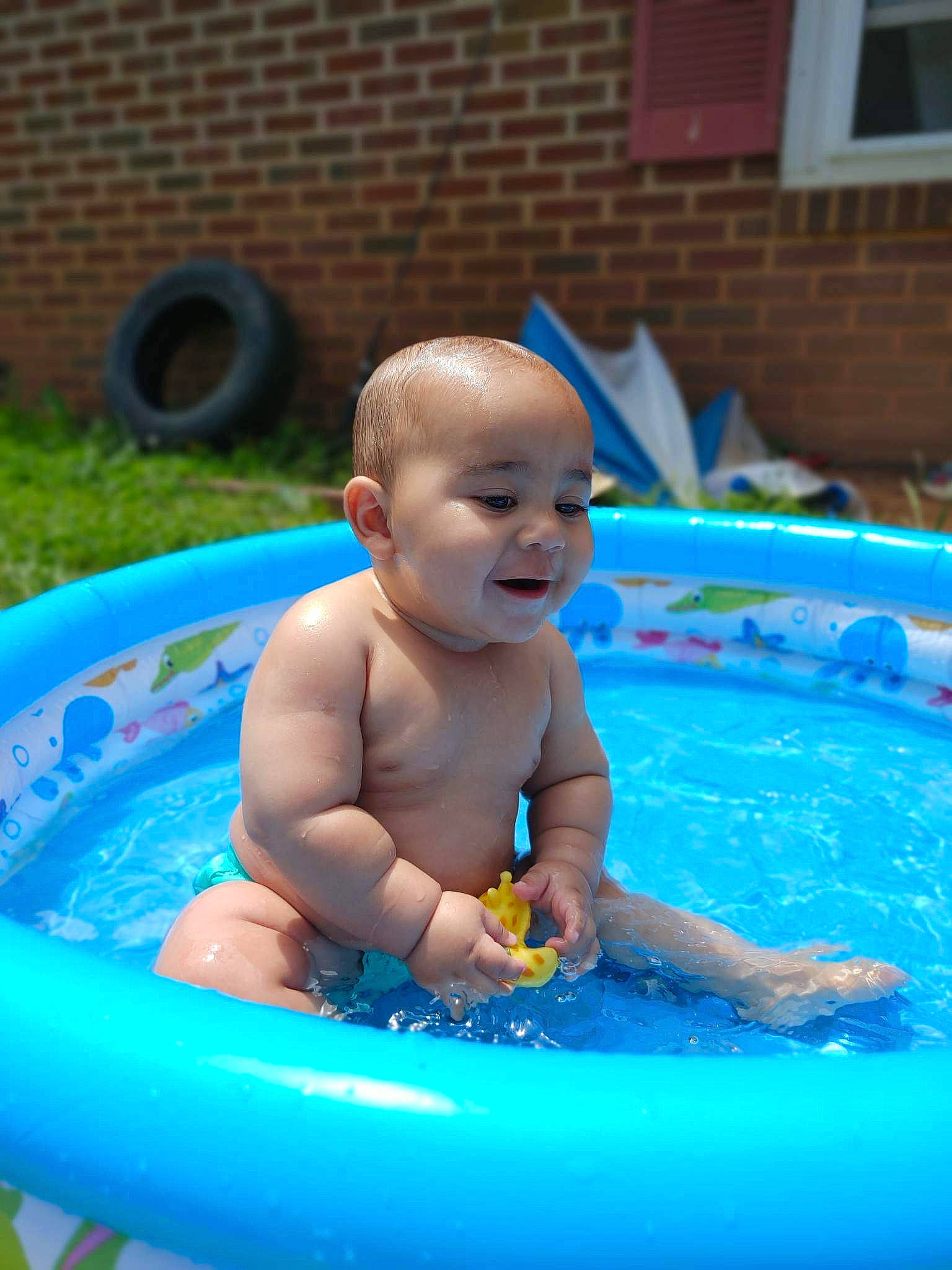 Khalil joined the competition — help win amazing prizes! baby, baby_bathing, baby_products, bathing, blue, child, fluid, fun, games, happy, inflatable, leisure, liquid, person, play, recreation, smile, swimming_pool, toddler, water