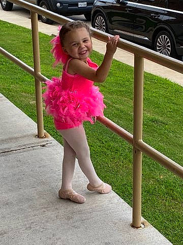 Kristina is registered to the contest to win money with this photo: automotive_exterior, automotive_tire, ballet_tutu, car, event, flower, grass, happy, human_leg, joy, motor_vehicle, person, personal_luxury_car, plant, smile, sportswear, thigh, tire, toddler, vehicle_door