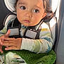 Mateo joined the competition — help win amazing prizes! babytrend, blanket, car, car_seat, child, clothing, cozy, curly_hair, cute, expression, face, hands, indoors, portrait, safety, seatbelt, sitting, toddler, warm_light, young_child