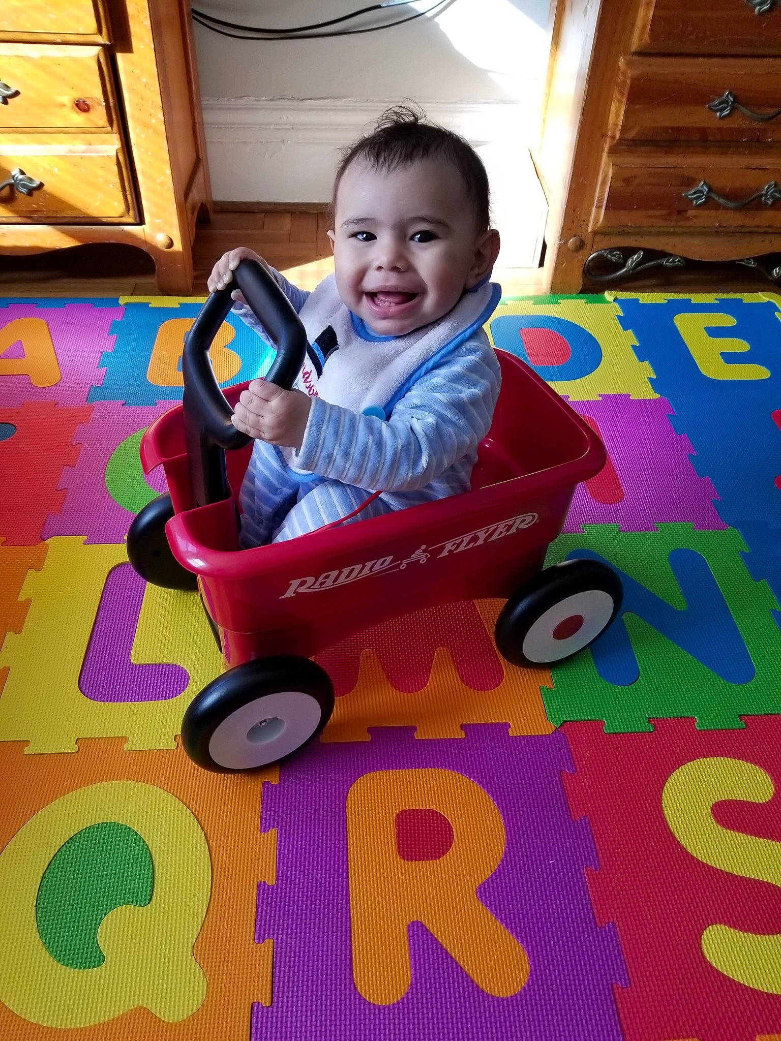 Jadiel is registered to the contest to win money with this photo: baby, baby_products, baby_toys, child, floor, flooring, joy, person, play, product, sitting, toddler, toy